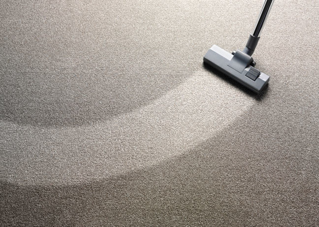 Vacuum cleaner on a carpet with an extra clean strip